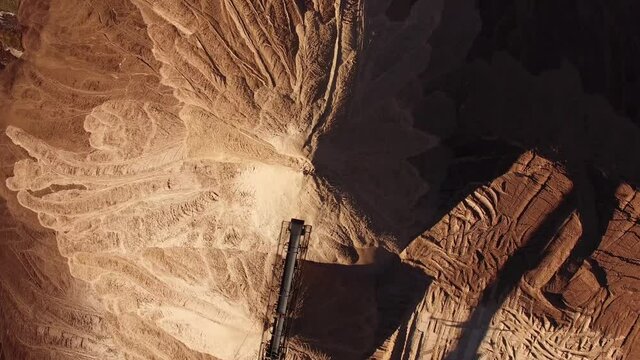 4k areal view flying over artificial mountains. Situated near Soligorsk city in Belarus, these mountains are formed by waste left after potash salt extraction from underground mines 