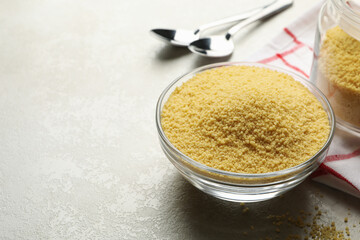 Concept of breakfast with couscous on gray table