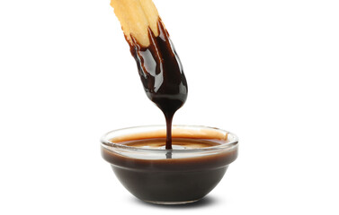 Tasty churros with chocolate sauce isolated on white background