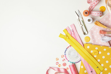 Sewing supplies on white background, space for text