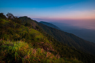 Beautiful sunrise over the mountain range and sea clouds
