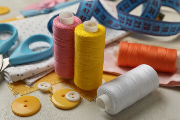 Sewing supplies on white background, close up