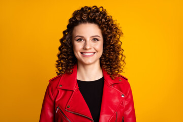 Close-up portrait of her she nice attractive cheerful cheery wavy-haired girl wearing leather coat isolated on bright vivid yellow color background