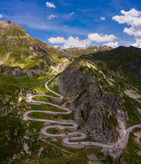 Aerial view of an old road going through the St. Gotthard pass in the Swiss Alps