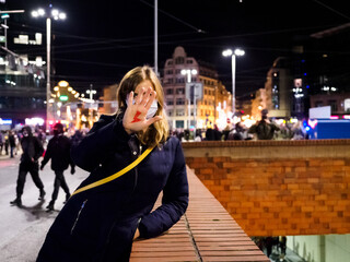Polish Woman has drawn a sign red lightning on her hand. Women Protest against tightening of the abortion law in Poland.