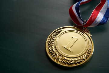 golden medal on green background