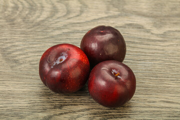 Ripe sweet plum fruit heap
