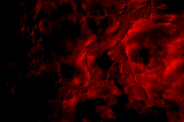 Blood texture with dark spots. Abstract blurred background of red color