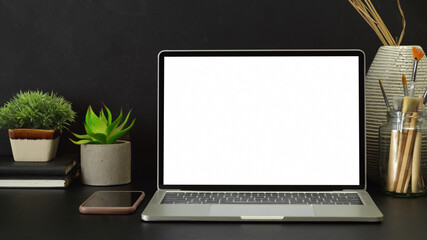 Fototapeta premium Worktable with laptop, smartphone, supplies and decorations, include clipping path
