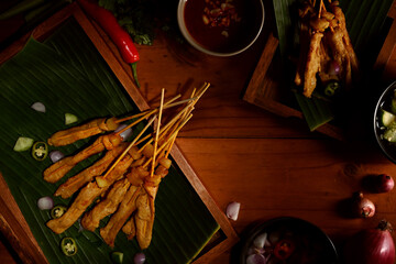 Grilled pork satay (Moo Satay) served with peanut sauce, Asian street food