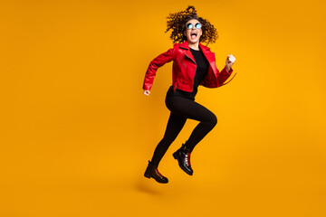 Full length body size view of nice crazy energetic cheerful wavy-haired girl jumping running having fun isolated on bright yellow color background