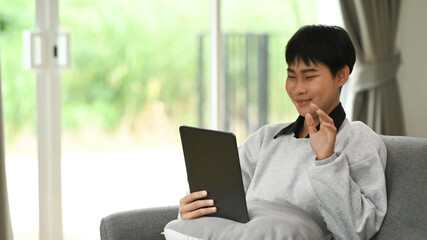 Young woman videocall using webcam and laptop modern technologies and distant communication at home.