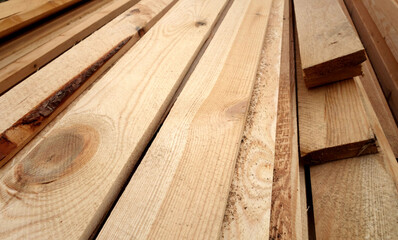 Pile of pine wooden boards