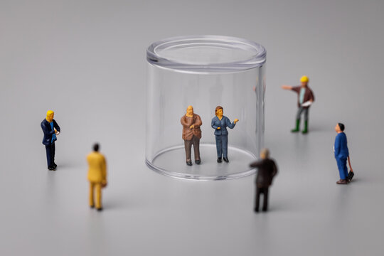 quarantine and social distancing during covid-19 virus pandemic concept. miniature people under the dome