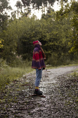 a girl walking through the forest