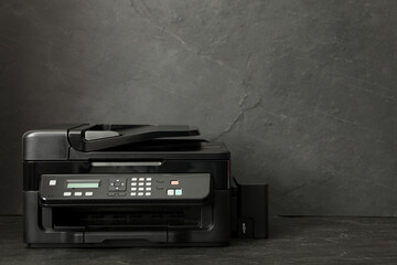 New modern printer on black background. Space for text