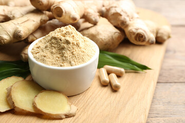 Dry, fresh and capsuled ginger on wooden table. Space for text