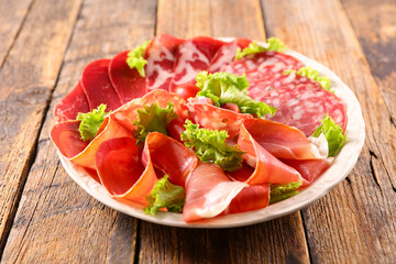 plate with salami, bacon, speck