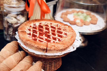 Cake on White Plate And Bread in Modern Bakery.