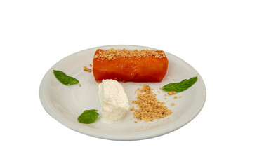 Pumpkin dessert in white plate, standing on isolated background.