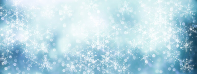Blue Christmas winter background - beautiful bokeh lights with snowflakes