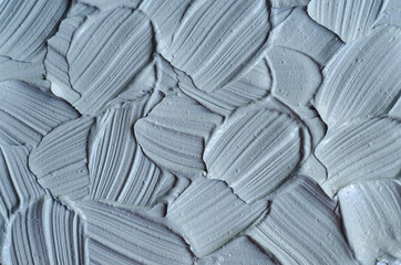 Gray bentonite facial clay (alginate mask, face cream, body wrap) texture close up, selective...