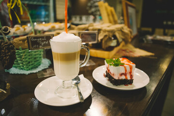 Coffee cocktail with milk in a glass on an old wooden table in a restaurant. glass of fresh coffee cocktail on the table..