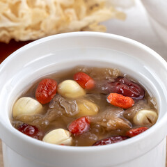 Close up of sweet snow white fungus soup with lotus seed, Chinese red dates and wolfberry.