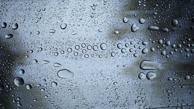 Water droplets on the roof on a rainy day dark