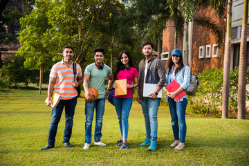 Education is fun - Cheerful Indian asian young students enjoying togetherness in college campus