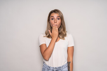 Amazed woman shocked looked isolated on a white background