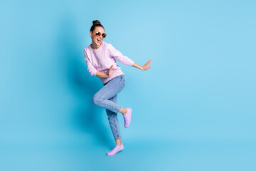 Fototapeta na wymiar Full body photo of positive cheerful girl enjoy rejoice dance discotheque wear good look sweater sneakers specs isolated over blue color background