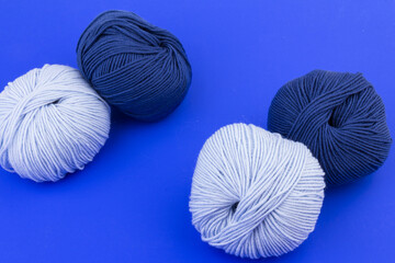 woolen merinos blue threads on blue background. natural wool. knitting. background