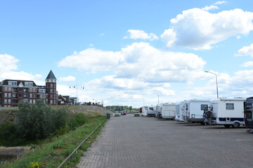 campers on quay near river Rhine