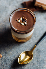 Delicious chocolate and cream dessert in the glass