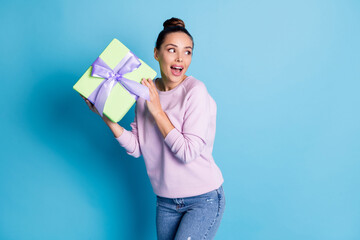 Photo of funky funny girl look copyspace prepare gift box for friends anniversary want hide wear pullover isolated over blue color background