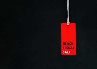 Black friday. Red Sale tag on the black background