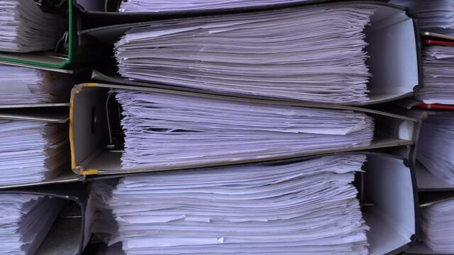 4K closeup video of papers and files in archives of business financial documents