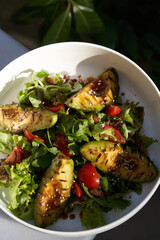 Avocado salad with fresh leaves and vegetable