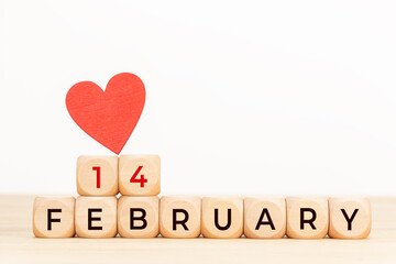 14 february text on wooden blocks and heart shaped on table. Valentines day concept
