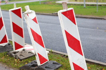 roadwork with white red signs