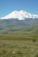 The road goes to huge mountain Elbrus