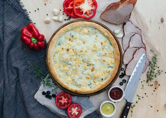 Tasty italian pizza made from an authentic recipe. Mozzarella topping mealted on top. Sauce aside. Professional product photography.