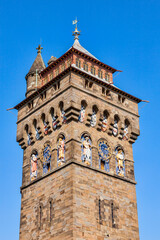 Fototapeta na wymiar The clock tower of Cardiff Castle Wales UK completed in 1873 which is part of the wall of the 12th century Norman fort which is a popular tourism travel destination attraction landmark of the city