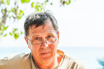portrait of attractive mature man in midday heat