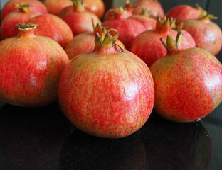 Fototapeta na wymiar Fresh ripe pomegranates prepared for juice