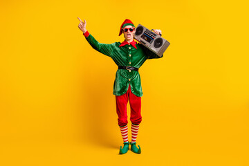 Full length body size view of his he nice attractive cool cheerful funny guy elf carrying player...