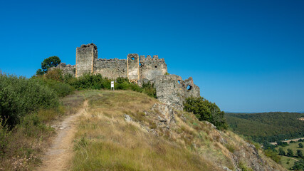 Fototapeta na wymiar Soimos Fortress standing on a hilltop in a sunny summer day. Romania