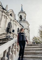 woman standing on large stone staircase old historical temple fortress building church 