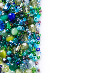 Lot of different glass beads, seed beads on white background